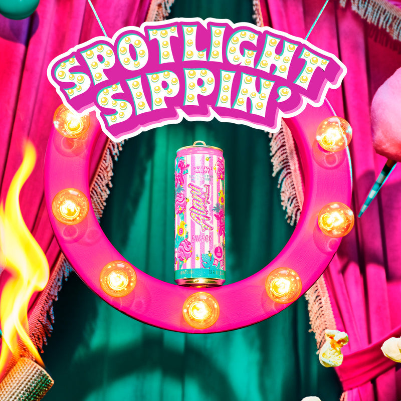 A can of Cotton Candy Alani Nu in a bright pink spotlight scene